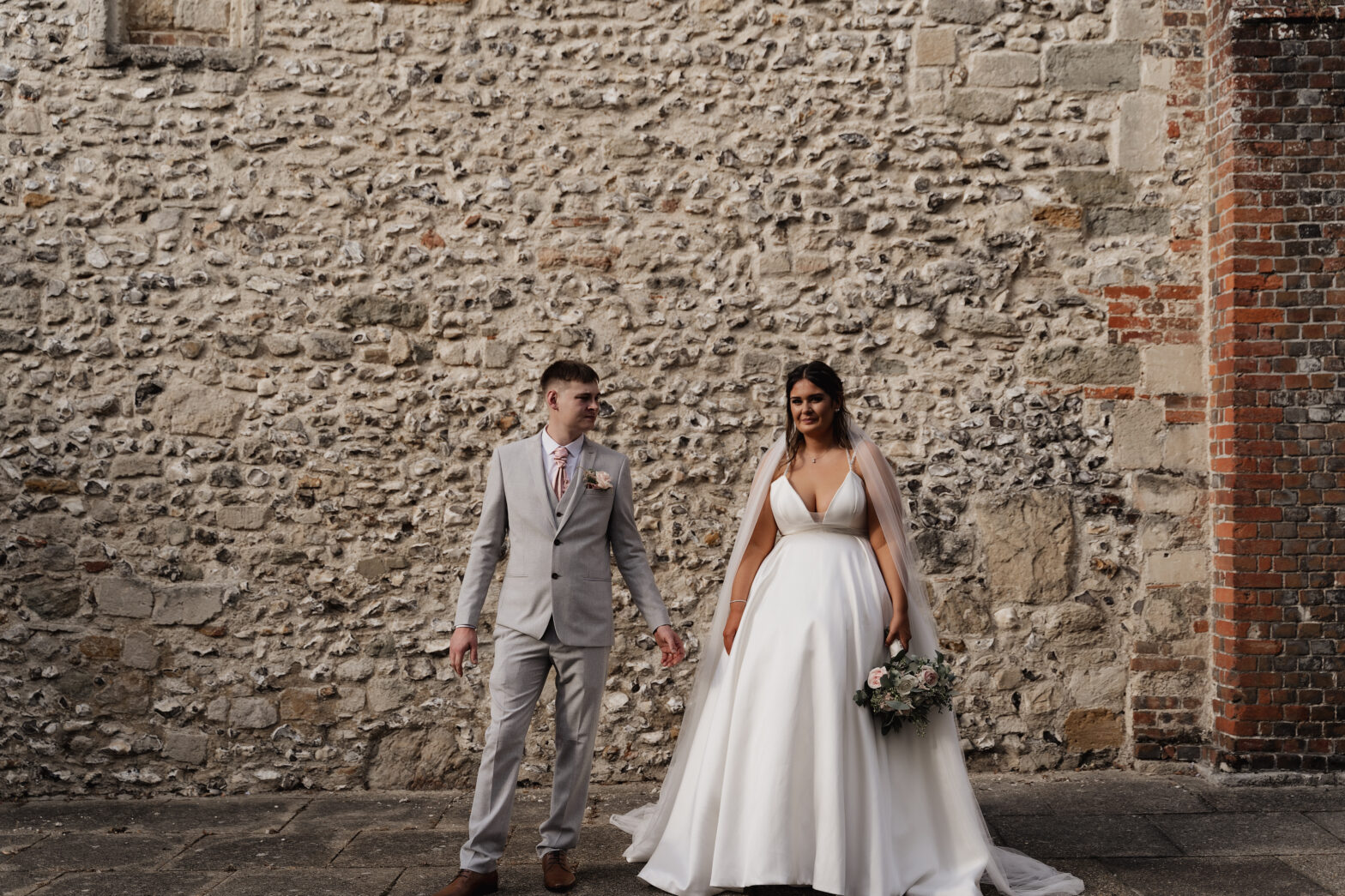 A candid photo of a couple during their wedding ceremony, captured by a documentary-style photographer in Hampshire.